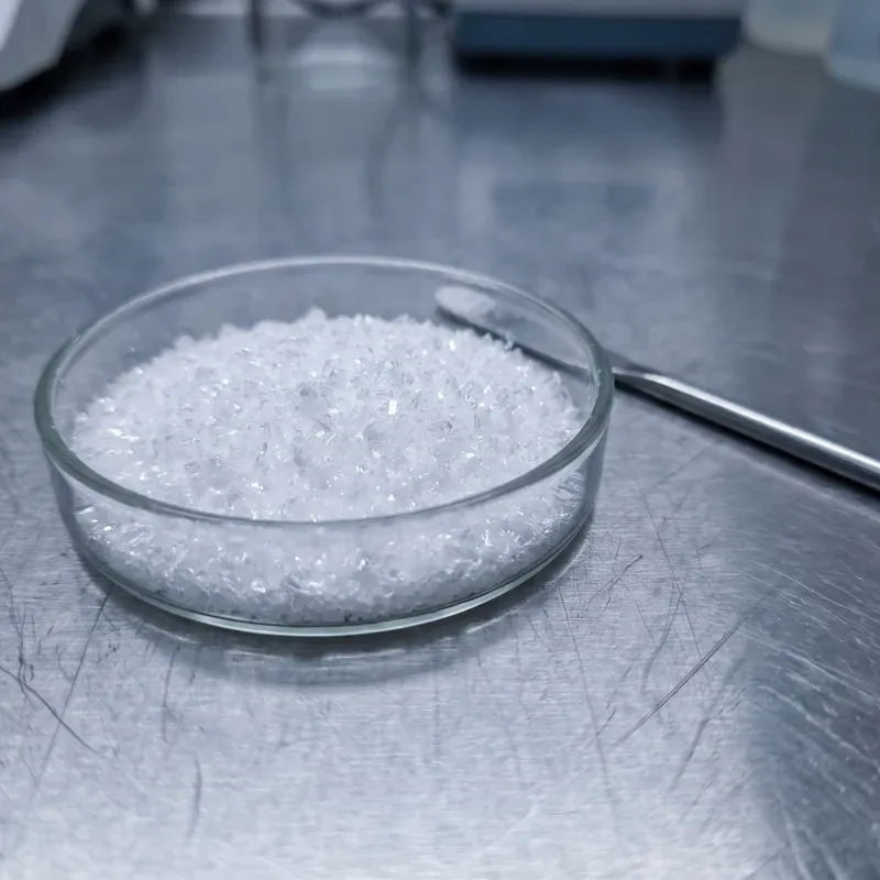 Fine white mineral crystals in a laboratory dish